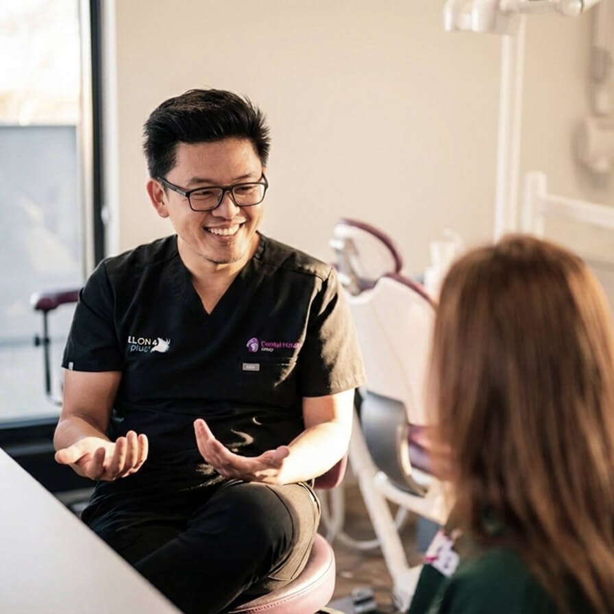 Dental professional consulting with patient